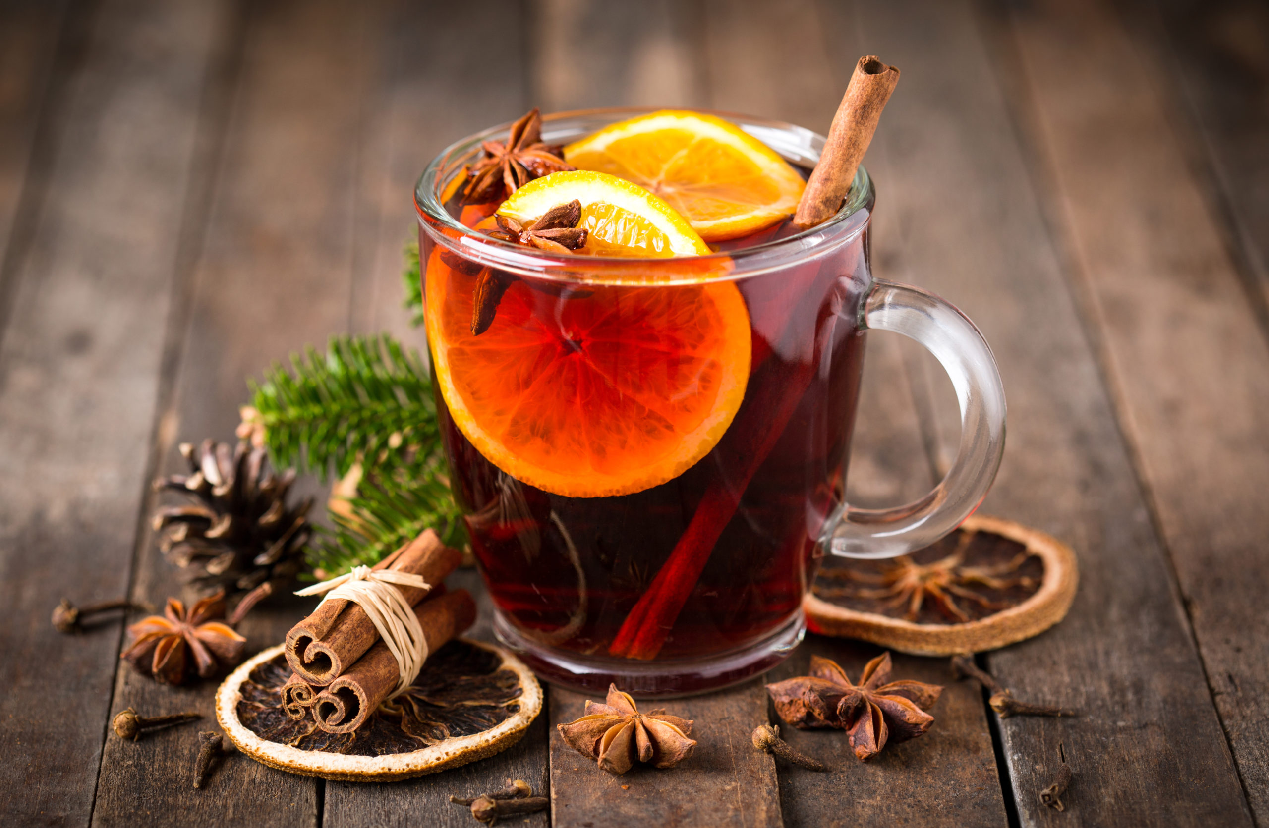 Hot black tea with lemon and mint on the wooden table